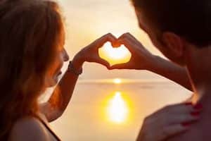 Anasayfa 4 young sexy romantic couple love happy summer beach together having fun wearing swim suits showing heart sign sundet 1